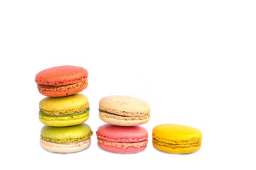 Colorful macarons on white background