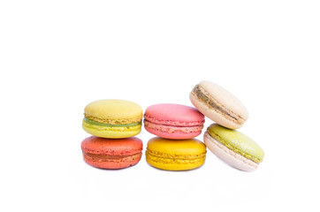 Colorful macarons on white background