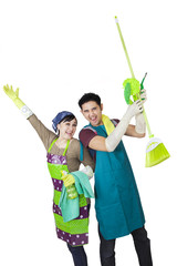 Cheerful couple with spring cleaning tools