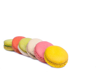 Colorful macarons on white background