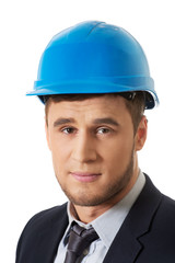 Happy businessman with blue hard hat.