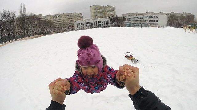 Happy Child Rotates in Winter Day, Slow Motion