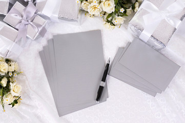 Wedding gifts white lace background with writing note paper and envelopes thank you list photo