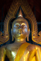 Fototapeta premium Face of famous large sitting Buddha in Thai Temple.