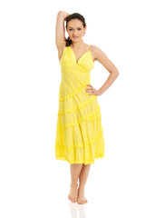 Naklejka premium Beautiful female model in yellow dress.