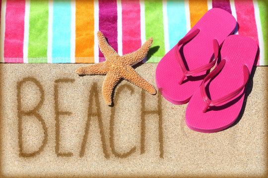 Beach vacation concept - word written in sand