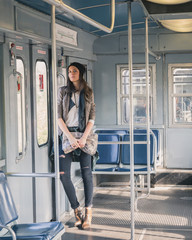 Pretty girl posing in a metro car