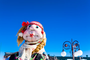 Scarecrow against the blue sky