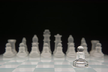 A pawn standing alone against the other team.