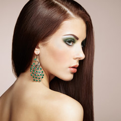 Portrait of beautiful brunette woman with earring