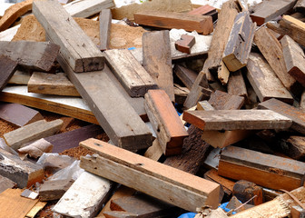 Pile of discarded lumber on plie of wood chips