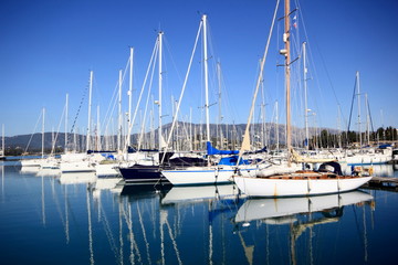 Stern to Mooring boats and yachts in marina