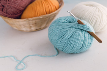 Ball of wool yarn with crochet hook