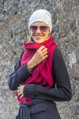 Happy young woman wearing red scarf