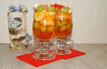 Fruity dessert - jelly with fruit in a glass bowl