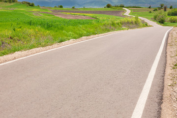 Empty winding road at spring