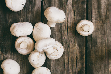 champignon on vintage wood table background - rustic style