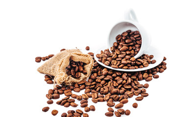 white cup with coffee beans isolated