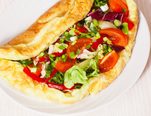 Omelet with vegetable salad