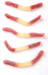 Brown and white sugar jelly candy strip over white background