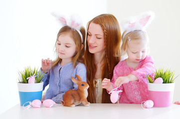 Mother and daughters wearing bunny ears on Easter