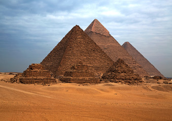Fototapeta na wymiar The Egyptian pyramids in the background of the desert.