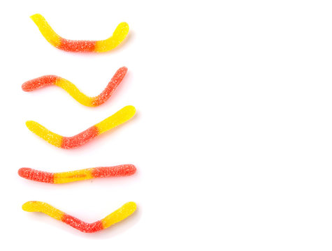 Red And Yellow Sugar Jelly Candy Strip Over White Background