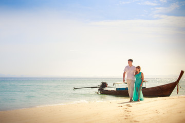 young happy asian couple on island