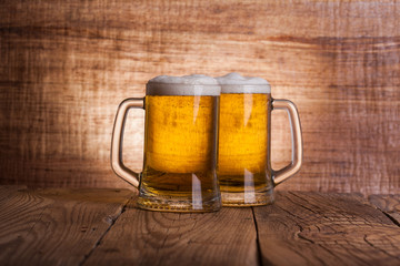 Glass beer on wood background