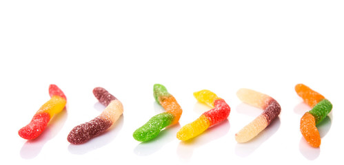 Colorful sugar jelly candy strip over white background