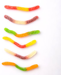 Colorful sugar jelly candy strip over white background