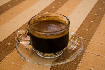Coffee, put on cotton brown background.