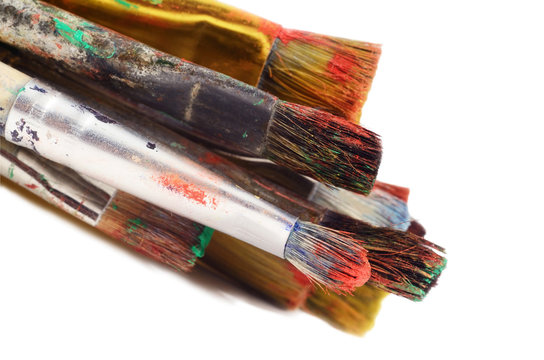 Closeup of different paintbrushes,artist tools,white background