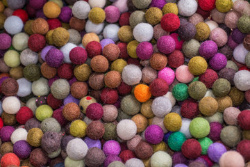 Fototapeta na wymiar Multi colored cotton balls