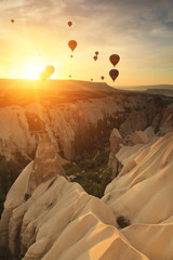Naklejka premium Hot air balloon over rock formations in Cappadocia, Turkey