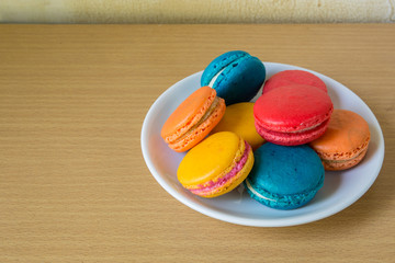 French macaroons on plate, with vintage pastel
