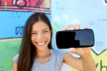 Smartphone - young ethnic woman showing screen