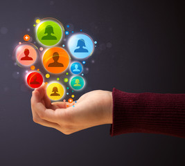 Social network icons in the hand of a woman