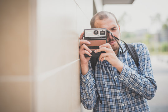 handsome hipster casual multitasking modern man with vintage cam