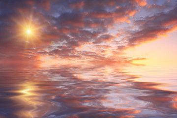 Beautiful sunset over sea with reflection in water