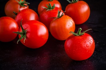 fresh organic cherry tomatoes with drops closeup