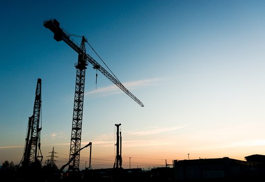 Construction crane at sunset.