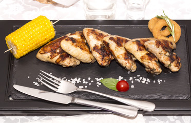 chicken wings are grilled