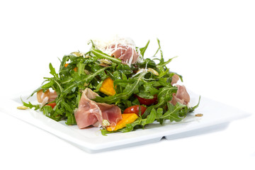 salad of arugula ham cheese on a white background