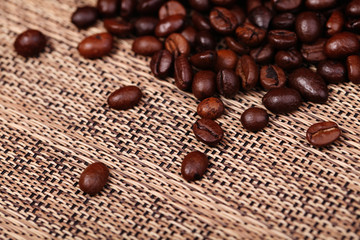 Coffee beans on the brown background