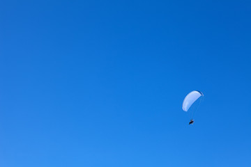 powered paragliding in the blue sky