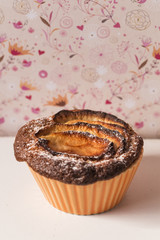 Homemade apple pie over a rustic white shelves and vintage wall