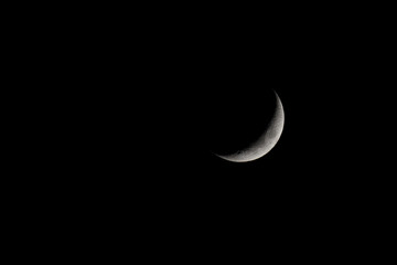 Waxing Crescent Moon Phase isolated on black