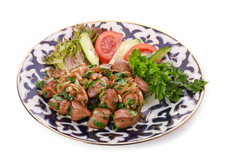 Fried meat with onion in a frying pan