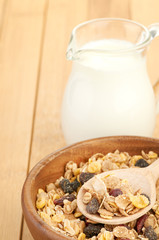 Delicious and healthy cereal in bowl with milk